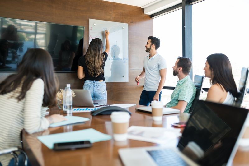Business Team Planning Strategy In Meeting Room